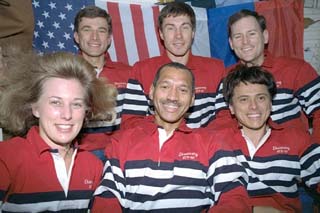 Crew members pose for the traditional in-space crew portrait.